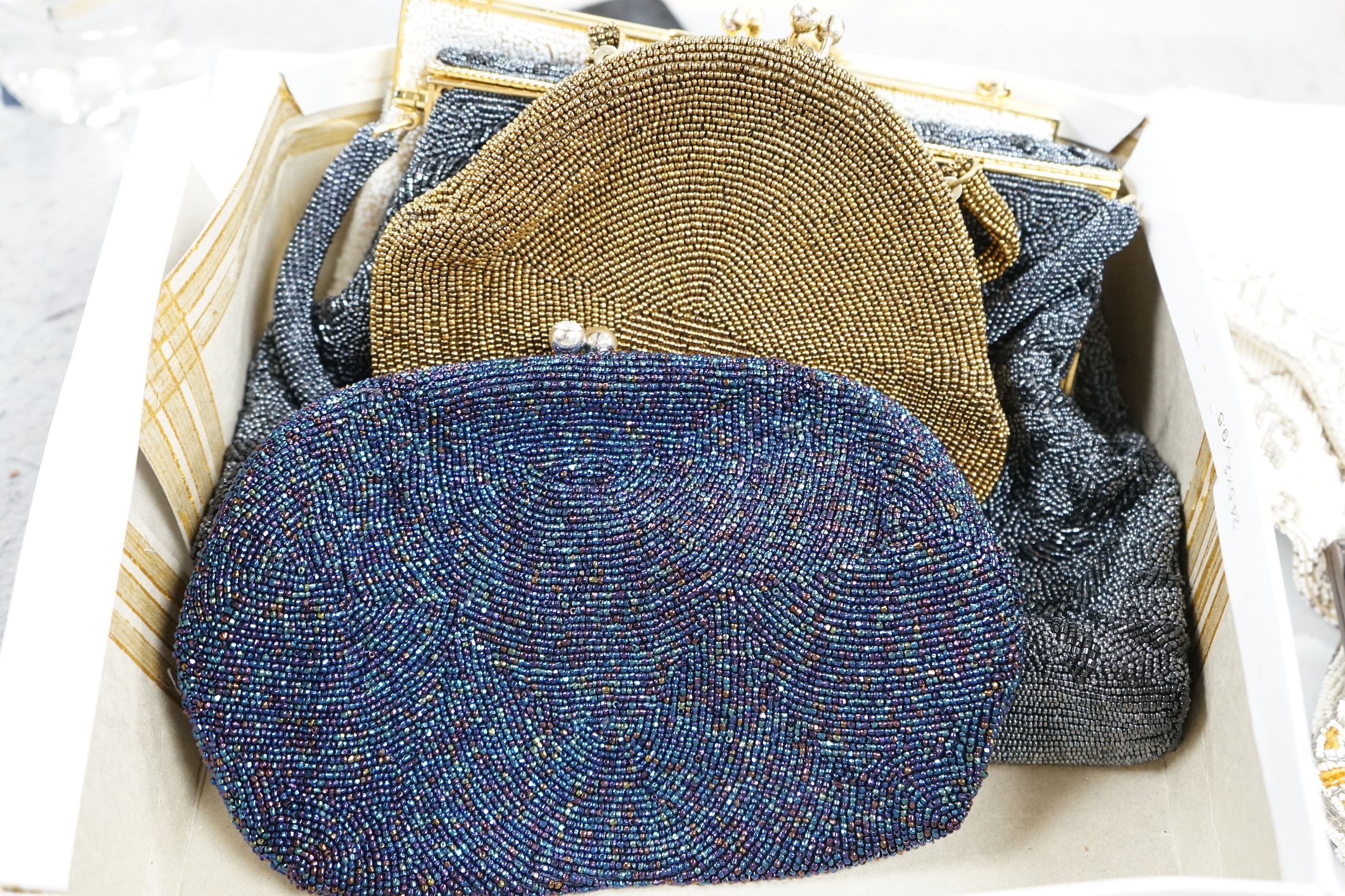 A collection of 1940’s-50’s beaded evening bags and clutch bags, largest 19cm high. (9). Condition - exterior good, a few interiors of bags marked from use